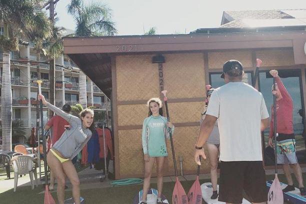 a group of people standing in front of a building